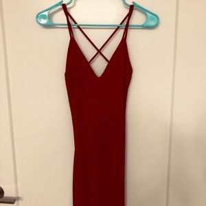 Maroon backless bodycon type dress.